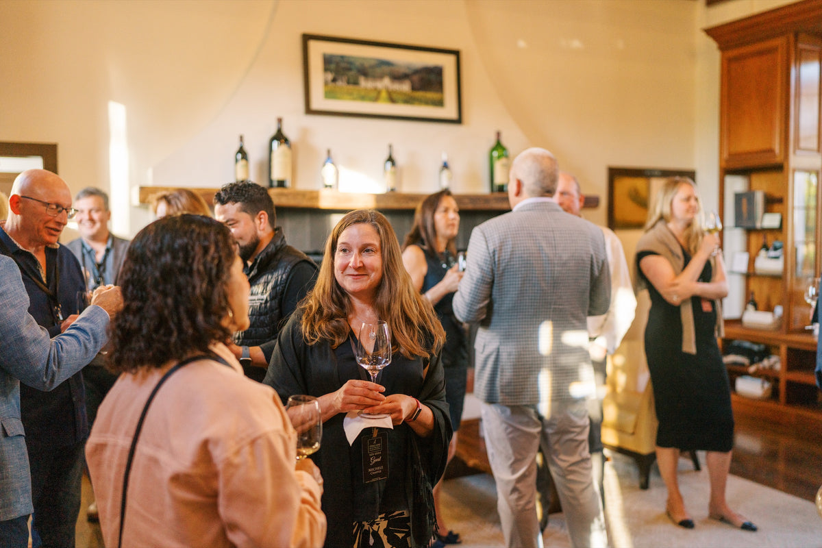 Guests gathered with glasses of Chimney Rock wine during a hosted tasting